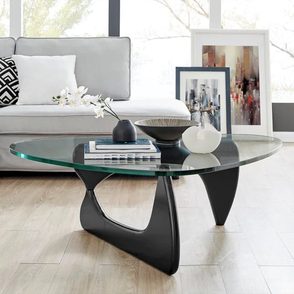 Noguchi Coffee Table in modern living room with stone fireplace and stylish furniture.
