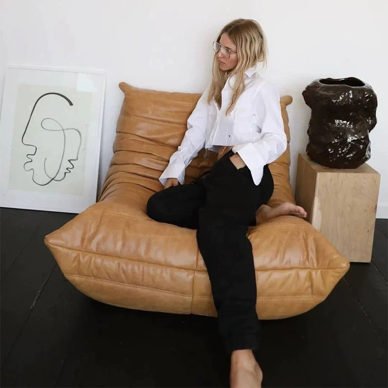 Togo Chair Fiber Leather Replica by Michel Ducaroy in a modern living space - sparkledecor.com