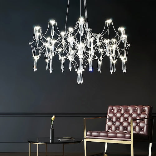 Stylish LED crystal chandelier illuminating a dining area with modern elegance - sparkledecor.com