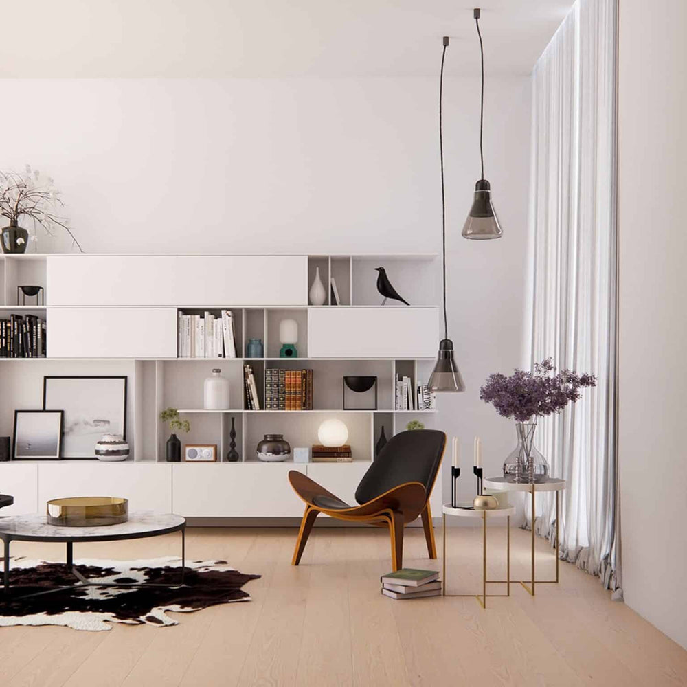 Elegant Shell Chair in black leather and walnut finish in stylish interior setting.