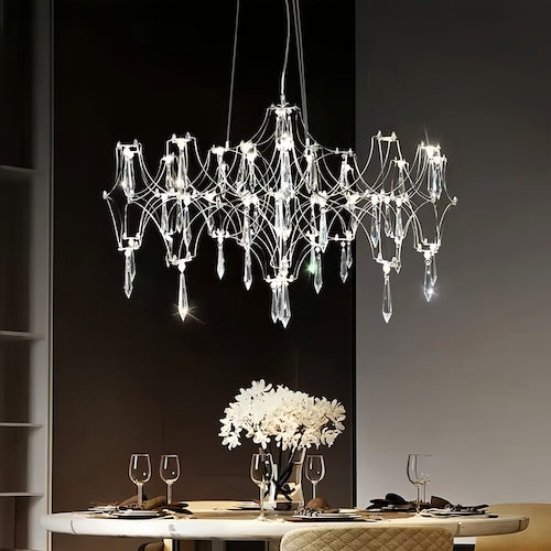 Stylish LED crystal chandelier illuminating a dining area with modern elegance - sparkledecor.com