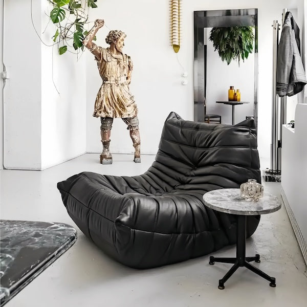 Togo Chair Fiber Leather Replica by Michel Ducaroy in a modern living space - sparkledecor.com